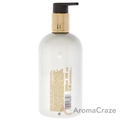 Picture of Mesmerising Oudh Accord and Gold Body Lotion by Molton Brown for Unisex - 10 oz Body Lotion